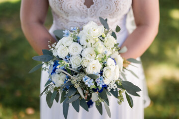 Bride holding wedding flowers close-up
