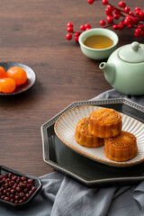 Delicious Cantonese moon cake for Mid-Autumn Festival food mooncake on wooden table background.