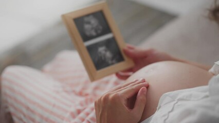 Baby, caring future mother in clothes for expectant mothers Full of love young white woman bears a child. modern mother white woman expecting a baby modern approaches to infant care. expectation