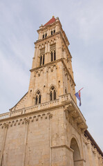 Fototapeta na wymiar The bell tower of the 13th century Cathedral of Saint Lawrence in Trogir in Croatia. Called Crkva Sv Lovre in Croatian