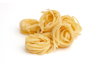 Raw Italian uncooked tagliatelle isolated on white background