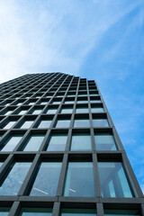 Low wide angle view of business office building. Glass wall Building Abstract background	