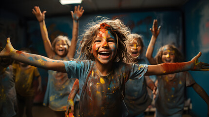 Fototapeta na wymiar Excited kids covered in paint, arms raised, smiling at the camera