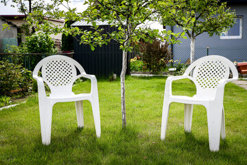 Two plastic chair in garden