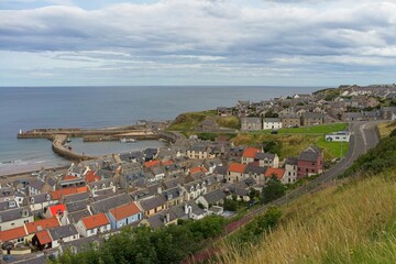   Cullen harbour viewed from Castle Hill in the north east of scotland