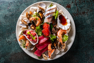 Set Seafood with salmon fish, tuna, shrimp, caviar on plate