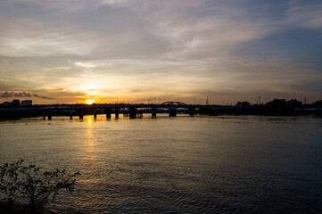 Fototapeta na wymiar Sunset silhouettes on Binh Trieu bridge in Ho Chi Minh City