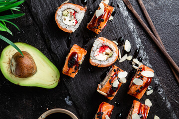 Various Sushi, rolls on a dark background