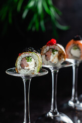 Various Sushi, rolls on a dark background