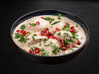 Chakhokhbili is a traditional dish of Caucasian cuisine, a stew of poultry stewed with vegetables, herbs and spices. Isolated on a dark background