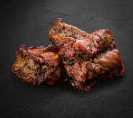 Grilled veal on a background of dark stone. BBQ menu