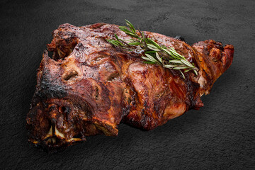 Grilled veal ribs, large piece on a dark stone background. BBQ menu