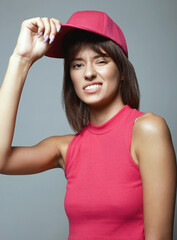 funny Girl in Red Hat. Smiling young woman
