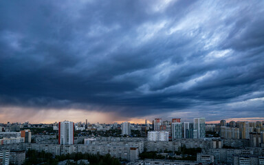Dawn clouds over the metropolis of early winter sunset
