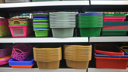 food storage containers and kitchen utensils on supermarket shelves for sale