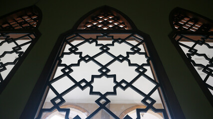 Fototapeta premium Arabic mosque window interior with silhouette