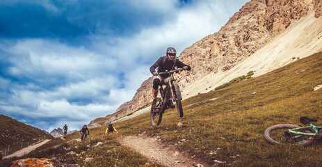 eMTB Electric Bike. Cyclist jumping on a bicycle. The route through the mountains.