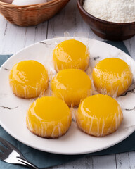 Quindim, traditional egg and coconut brazilian dessert with ingredients