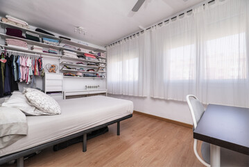  A double bedroom furnished with a padded box spring