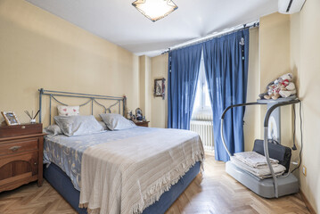 A double bedroom furnished in a classic style