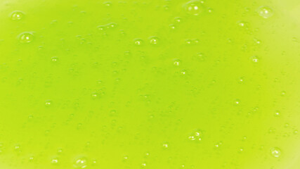 Green slime toy as a background.