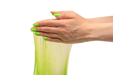 Green slime toy in woman hand with green nails isolated on a white background.