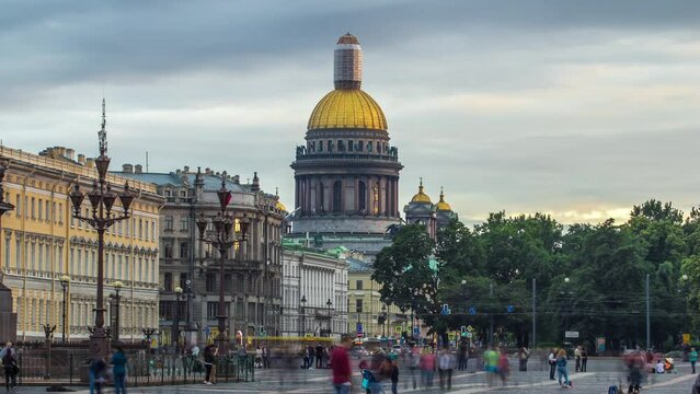At sunset, Saint Petersburg's largest cathedral, Saint Isaac's Cathedral, from Palace Square in this captivating timelapse hyperlapse. Completed in 1858, it stands as a city landmark. Dramatic clouds