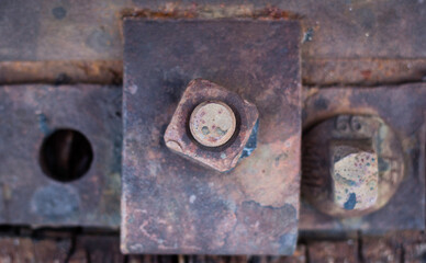 Train track highlighted, focus on train station hardware, railroad. Railway zoom, macro. Stones and steel, railroad construction.