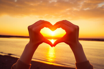 Female Hands Make Heart Shape On Sunset Sky