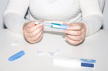 Female hands holding an insulin pen. Ozempic Insulin injection pen.