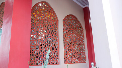 Arabic ornament on the mosque wall with red bricks