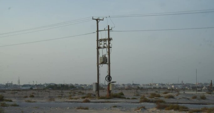 Electric pole in desert area close to oil fields in Riffa