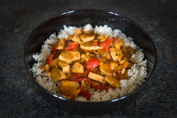 ready to eat - sliced and grilled chicken in a curry sauce with rice 