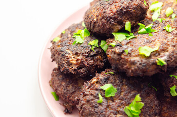 Fried minced cutlets served in a pile on a plate, typical eastern european homemade food