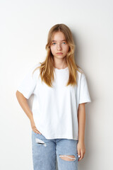 Obraz premium Portrait of young beautiful cute teen girl posing at camera