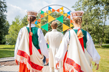 Young people in Latvian national costumes at the Latvian Song and Dance Festival