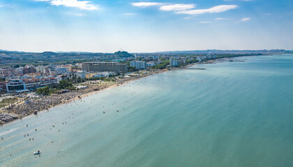  Golem, Durres, Albania - 22 august 2023: Aerial view to sandy beach full of umbrellas and people in summer season 2023