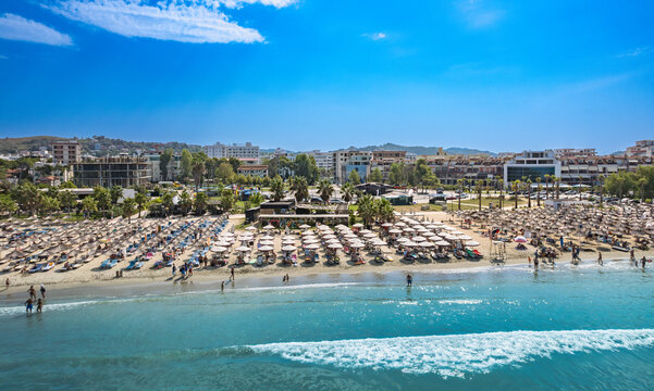  Golem, Durres, Albania - 22 august 2023: Aerial view to sandy beach full of umbrellas and people in summer season 2023