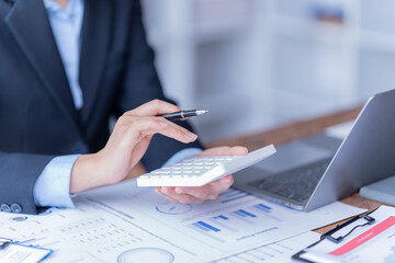 financial analysts analyze business financial reports planning investment project during a discussion at a meeting of corporate showing the results of their successful teamwork.