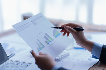 financial analysts analyze business financial reports planning investment project during a...