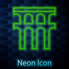 Glowing neon line Aqueduct of Segovia, Spain icon isolated on brick wall background. Roman Aqueduct building. National symbol of Spain. Vector