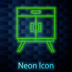 Glowing neon line Chest of drawers icon isolated on brick wall background. Vector