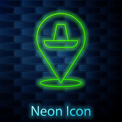 Glowing neon line Traditional mexican sombrero hat icon isolated on brick wall background. Vector