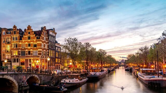 Amsterdam Netherlands time lapse 4K, city skyline day to night timelapse at canal waterfront