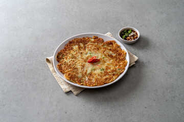 Korean food dish Grilled pork kimchi, potato pancake, egg roll, kimchi roll noodles, bibim noodles, side dishes