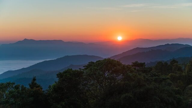 Tropical forest nature landscape with mountain range sunrise time lapse with moving cloud mist, Chiang Mai Thailand 4K timelapse