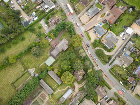Drone top down view of a road contraflow due to new gas pipes being laid in this rural English village.