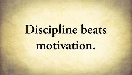 Old paper background with text. Discipline beats motivation.