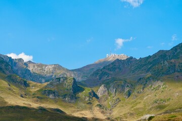 Look up from far on the mountain trails of the pic du midi de bigorre in the French Pyrenees. Majestic hills of Tourmalet, highest paved mountain passes in France, Europe