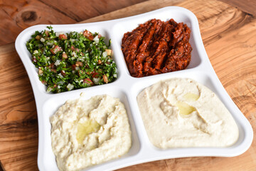Tabbouleh salad, Spicy Shatta sauce, Mutabal, hummus